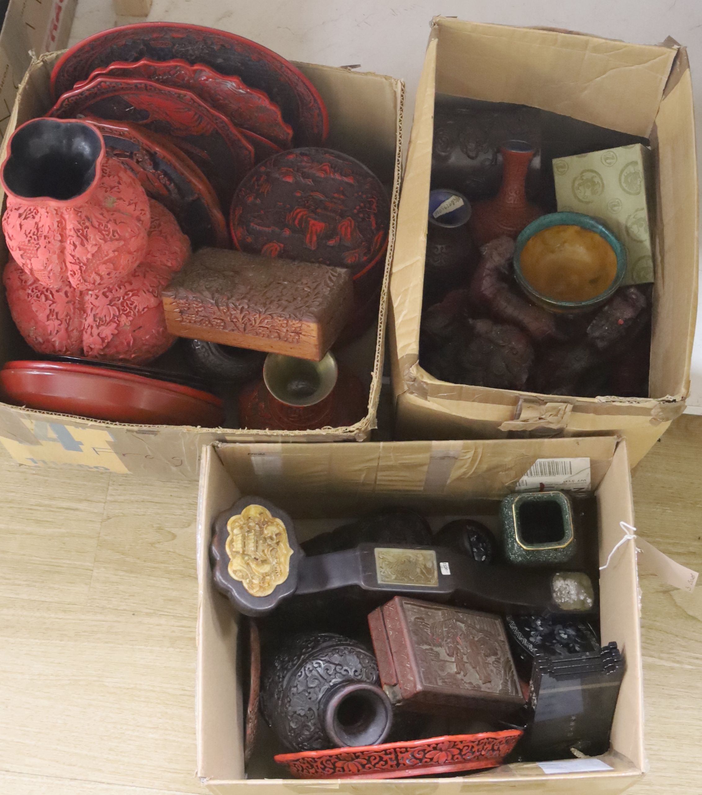 A quantity of red lacquer boxes and other ornaments